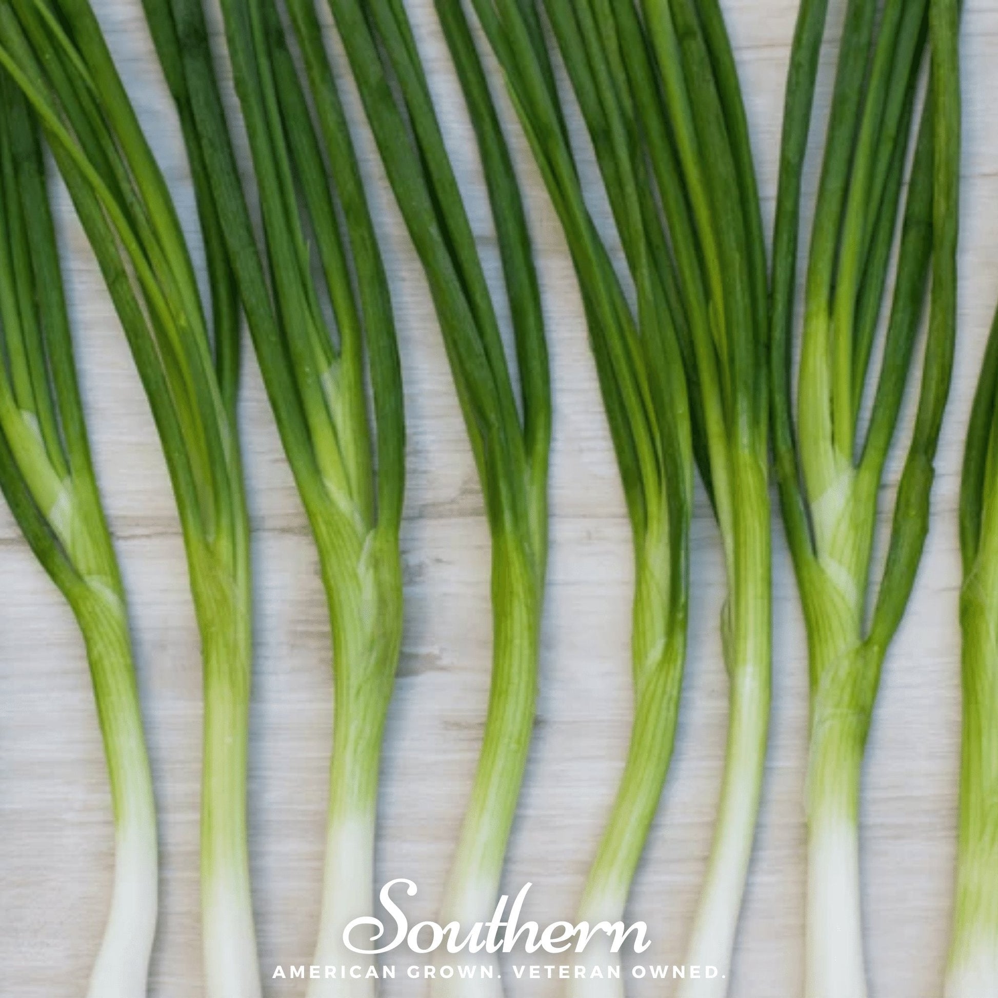 Green onions on a textured surface with 'Southern' branding.