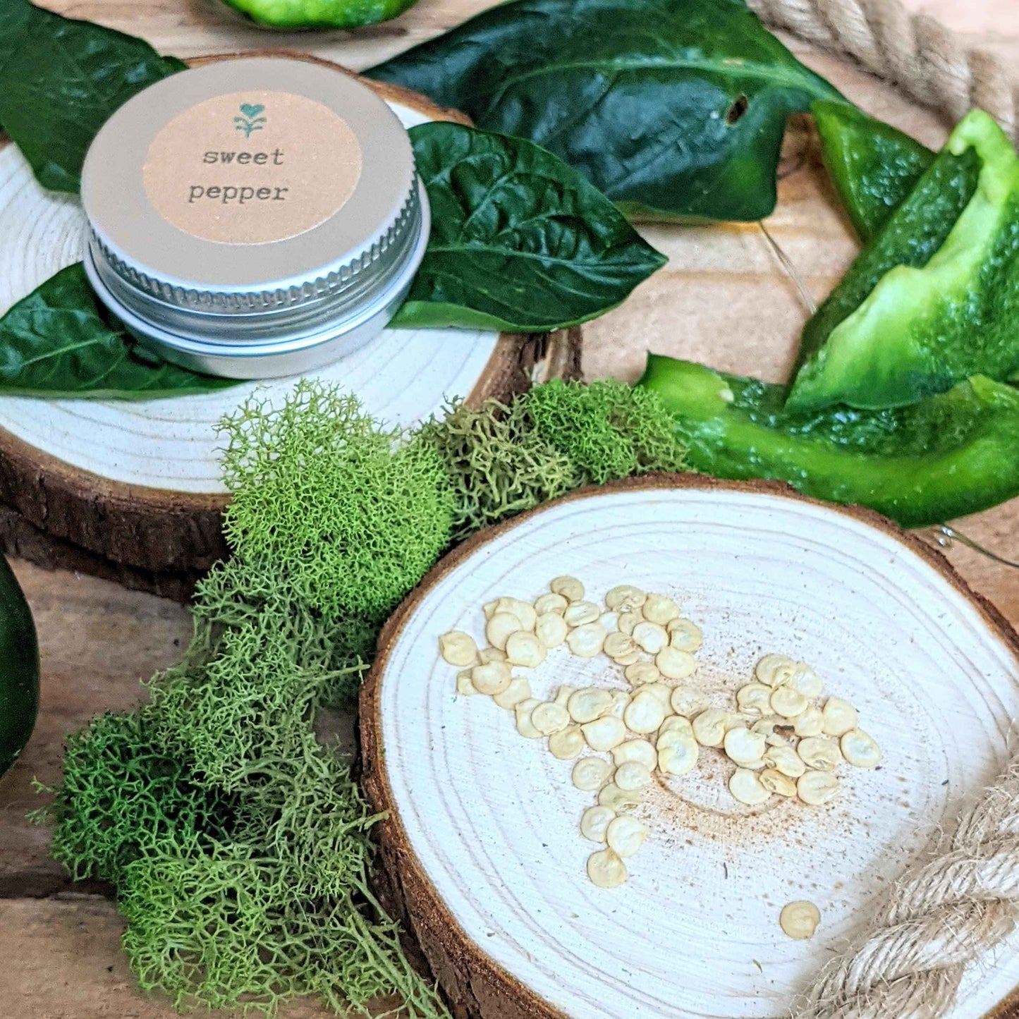 Jar labeled 'sweet pepper' with green leaves and a wooden surface