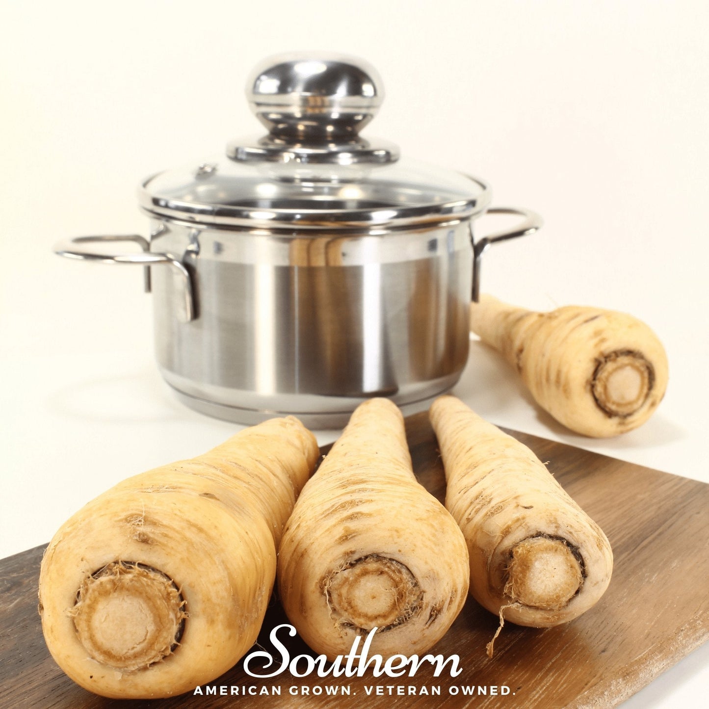 Stainless steel pot with parsnips on a wooden board, featuring 'Southern' brand.