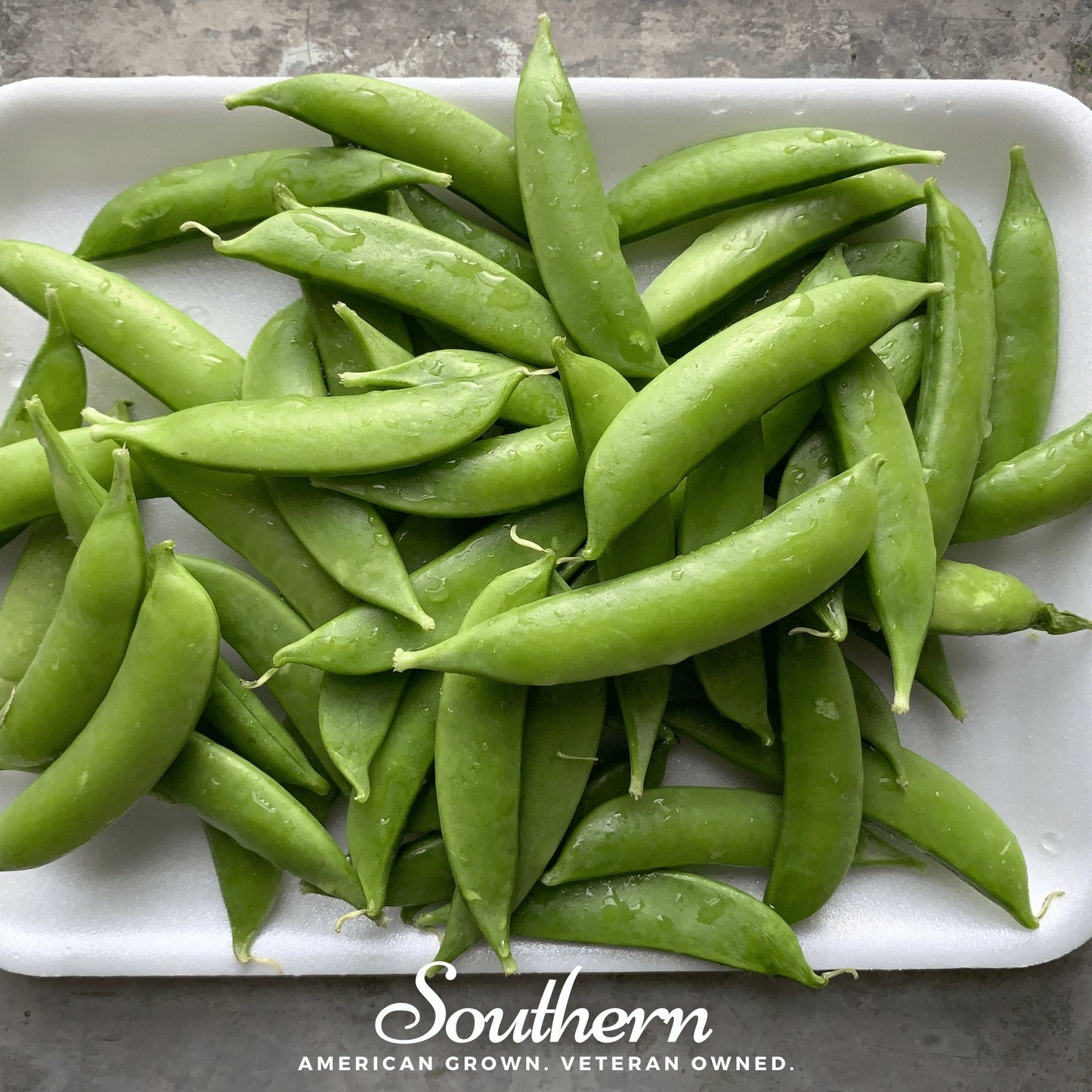 Green beans on a white plate with 'Southern' branding at the bottom.