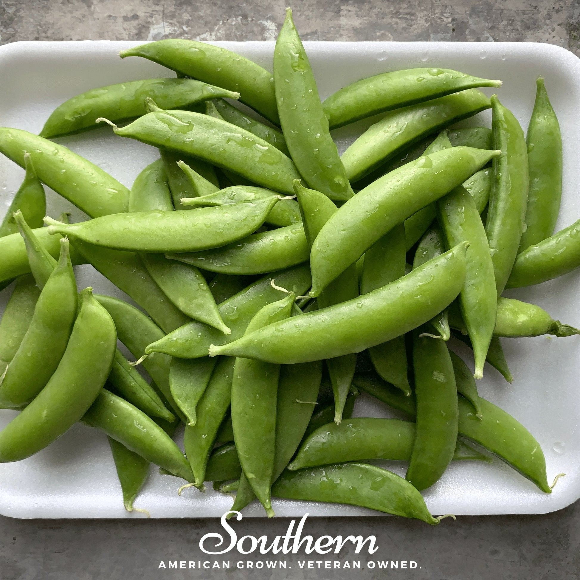 Green beans on a white plate with 'Southern' branding at the bottom.