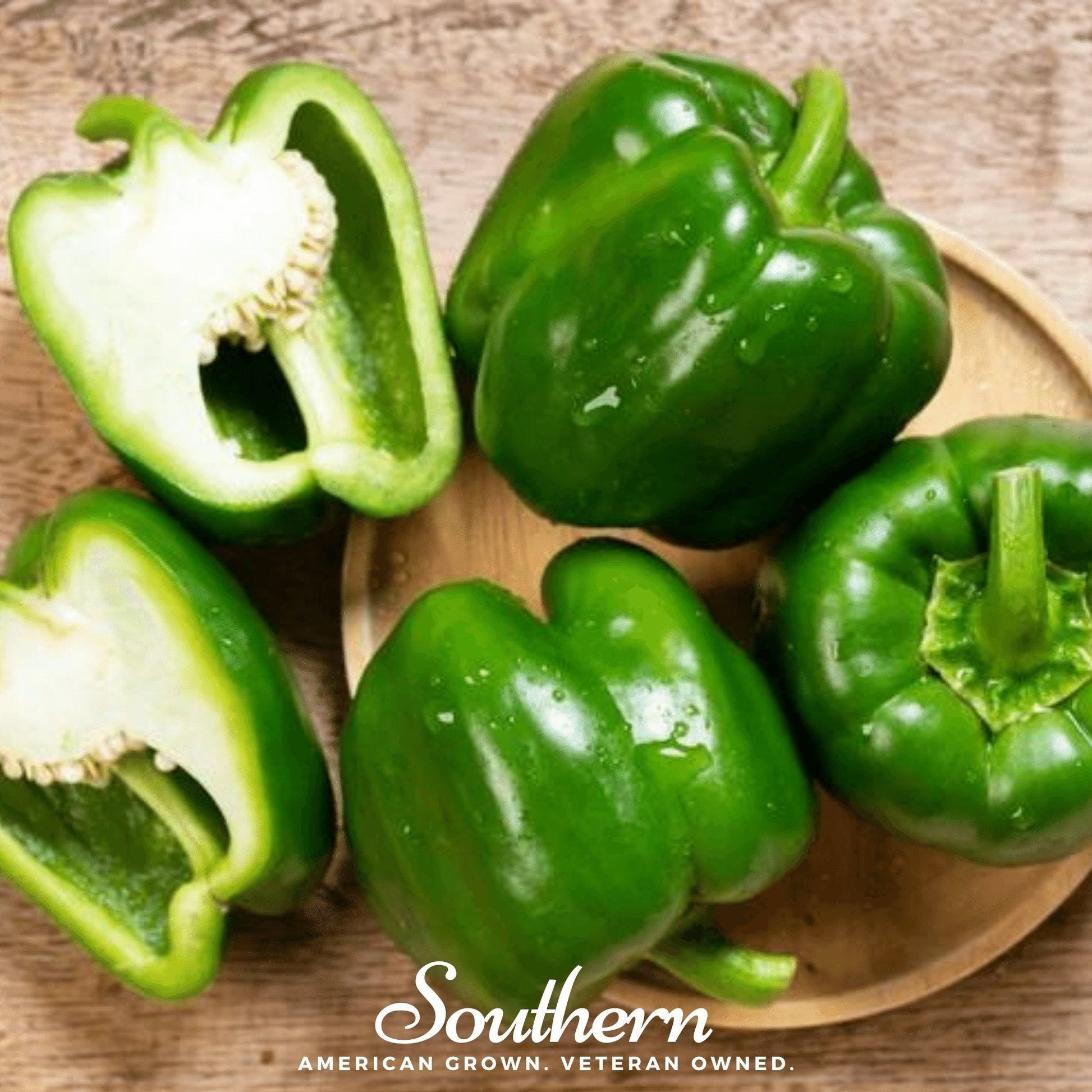 Green bell peppers on a wooden plate with 'Southern' brand text.