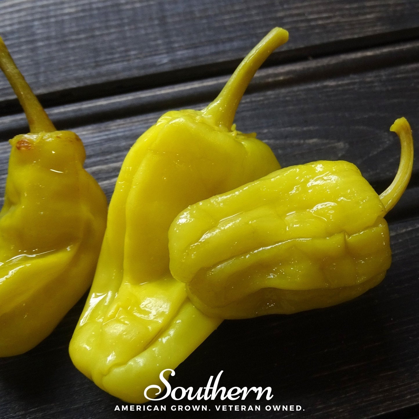 Three yellow peppers on a dark surface with 'Southern' branding.