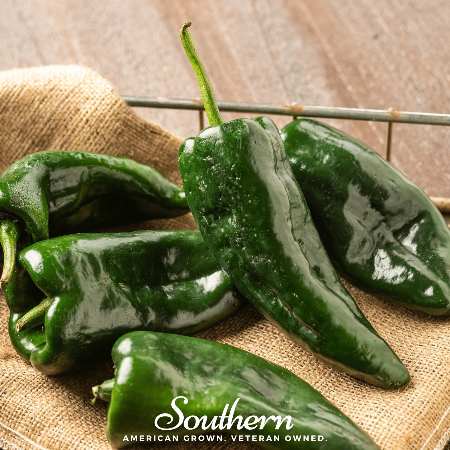 Green poblano peppers on a wooden surface with 'Southern' branding.