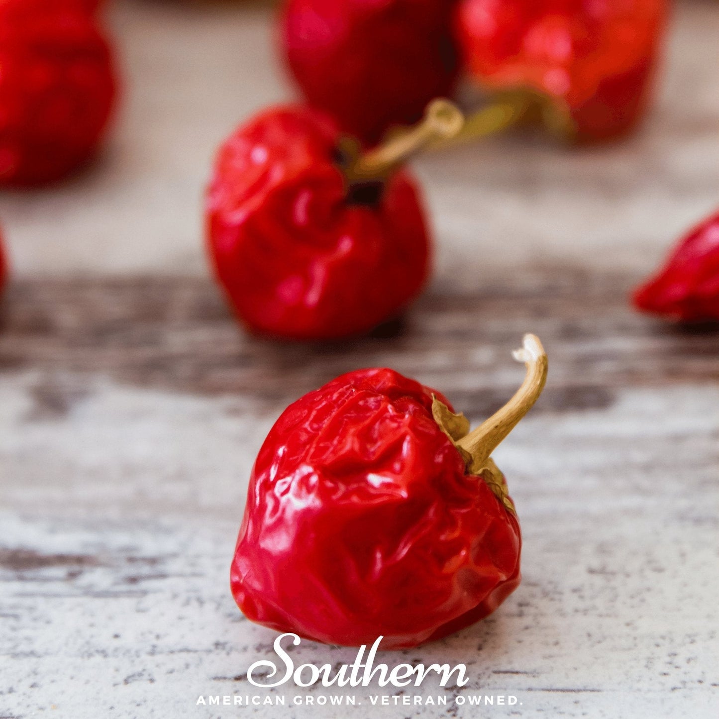 Dried red chili peppers on a wooden surface with 'Southern' branding.