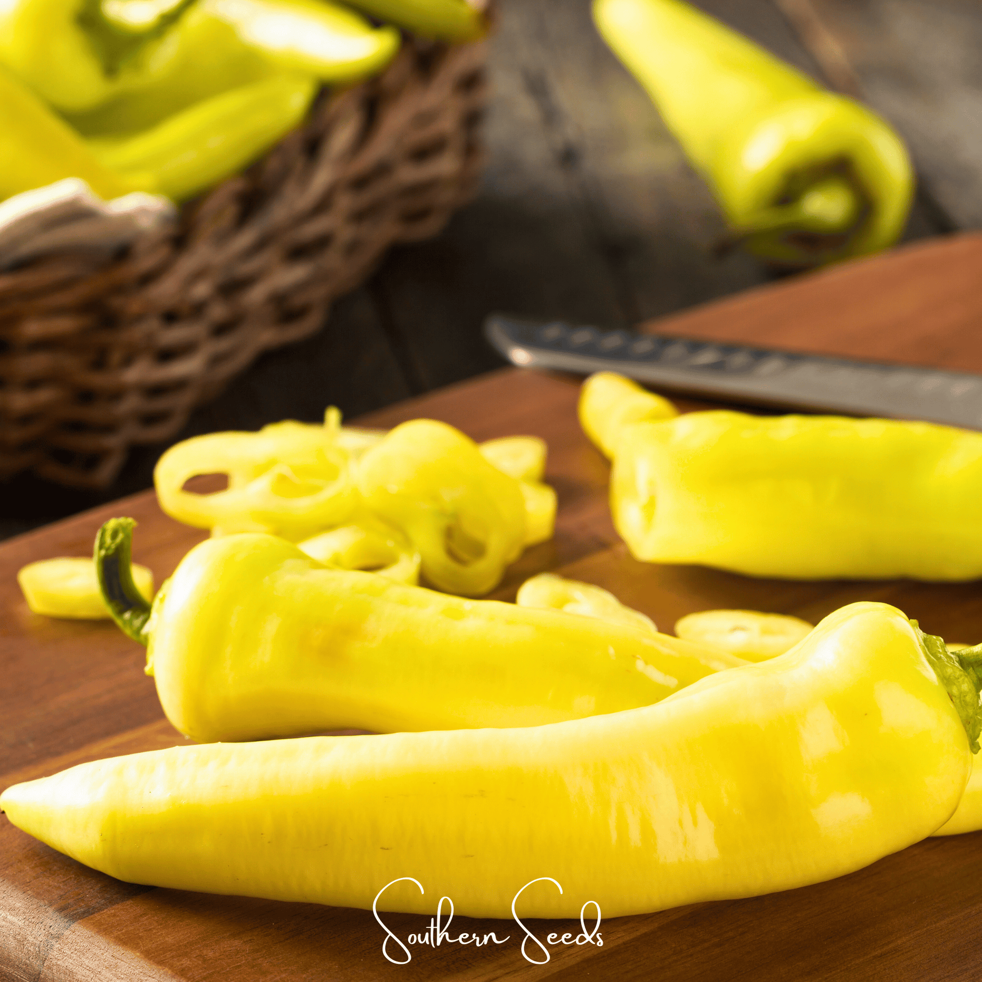 Yellow peppers on a wooden cutting board with a blurred background