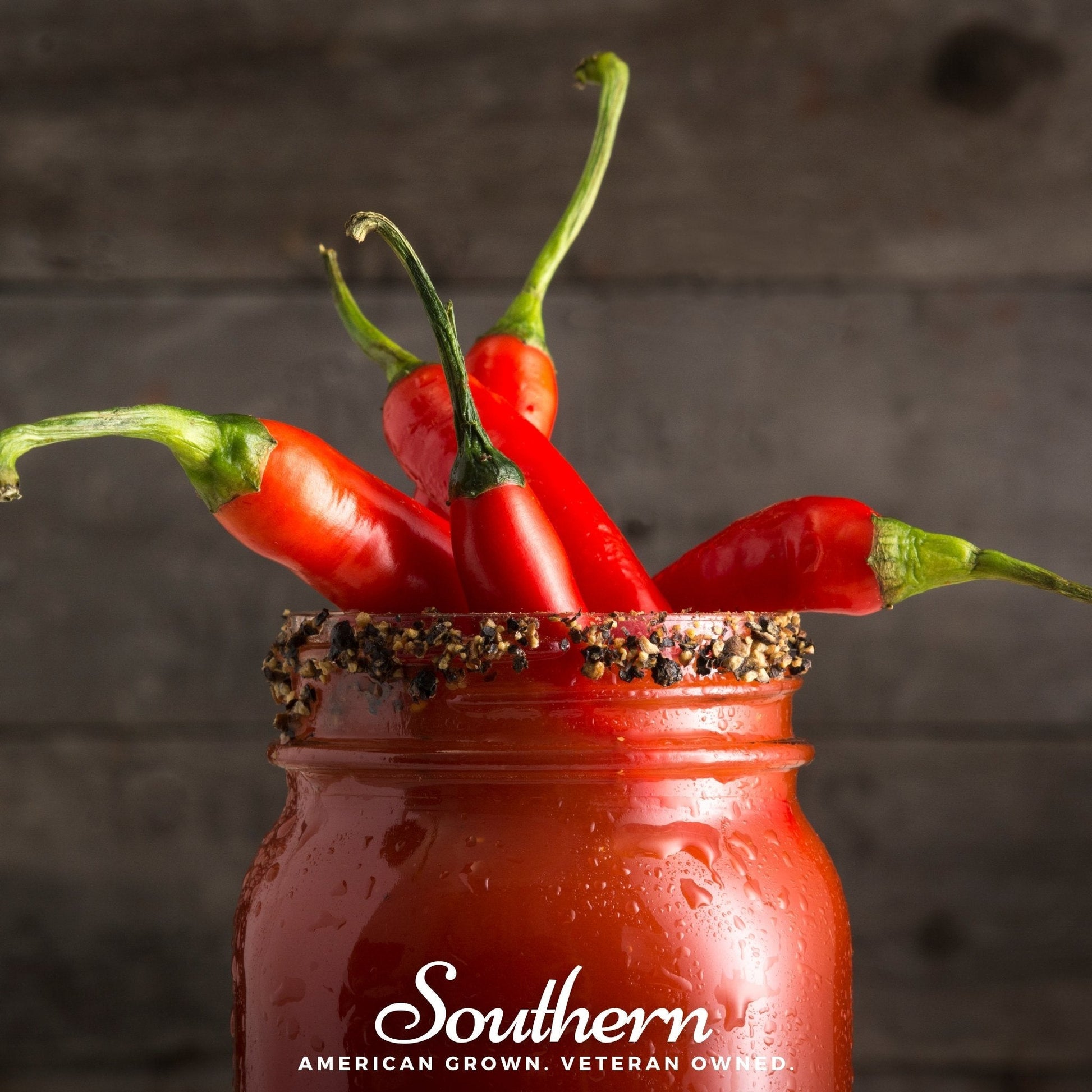 Red peppers in a jar with 'Southern' branding on a dark background