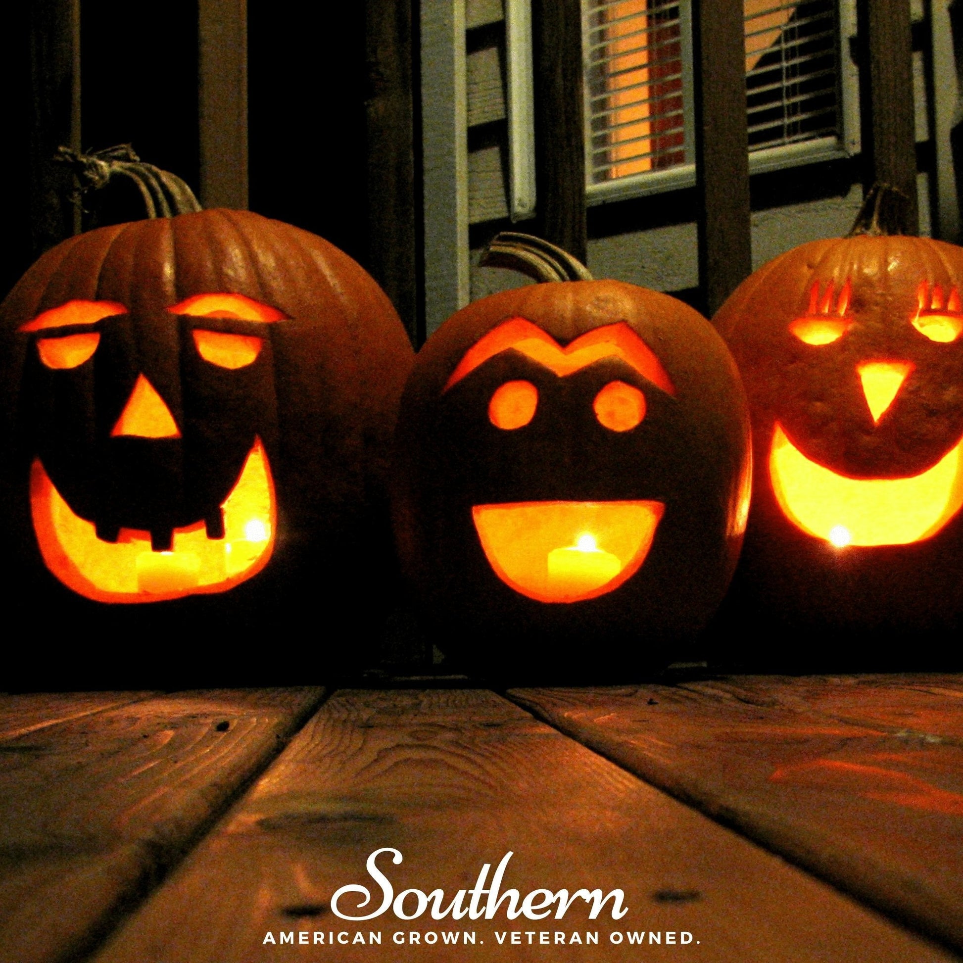 Three carved pumpkins with glowing faces on a wooden surface, featuring the 'Southern' brand.