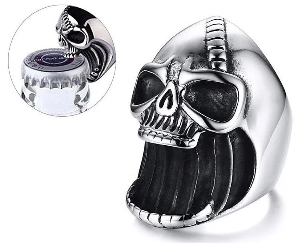 Skull-shaped ring used as a bottle opener on a white background