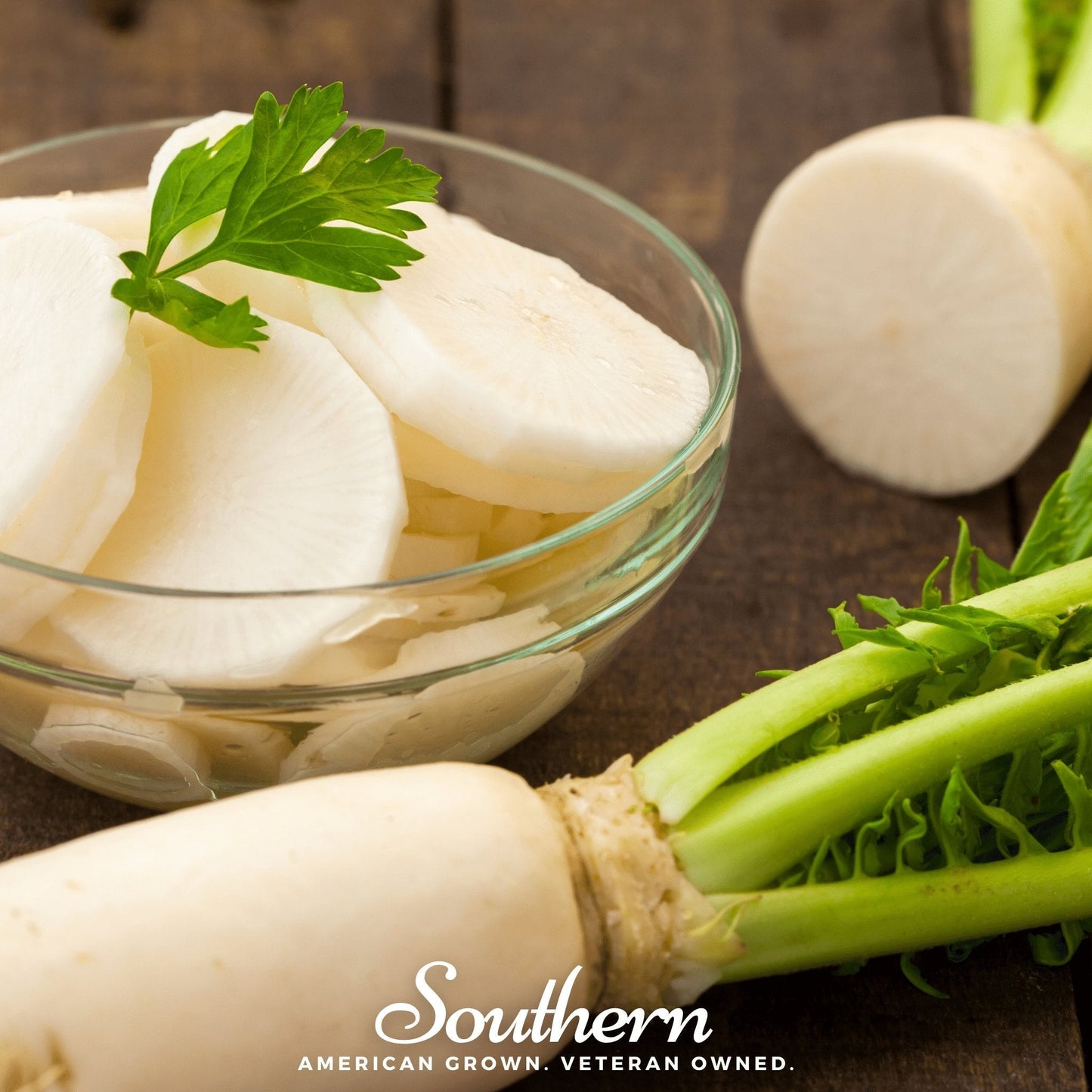 Sliced radishes in a glass bowl with whole radishes on a wooden surface, featuring 'Southern' branding.
