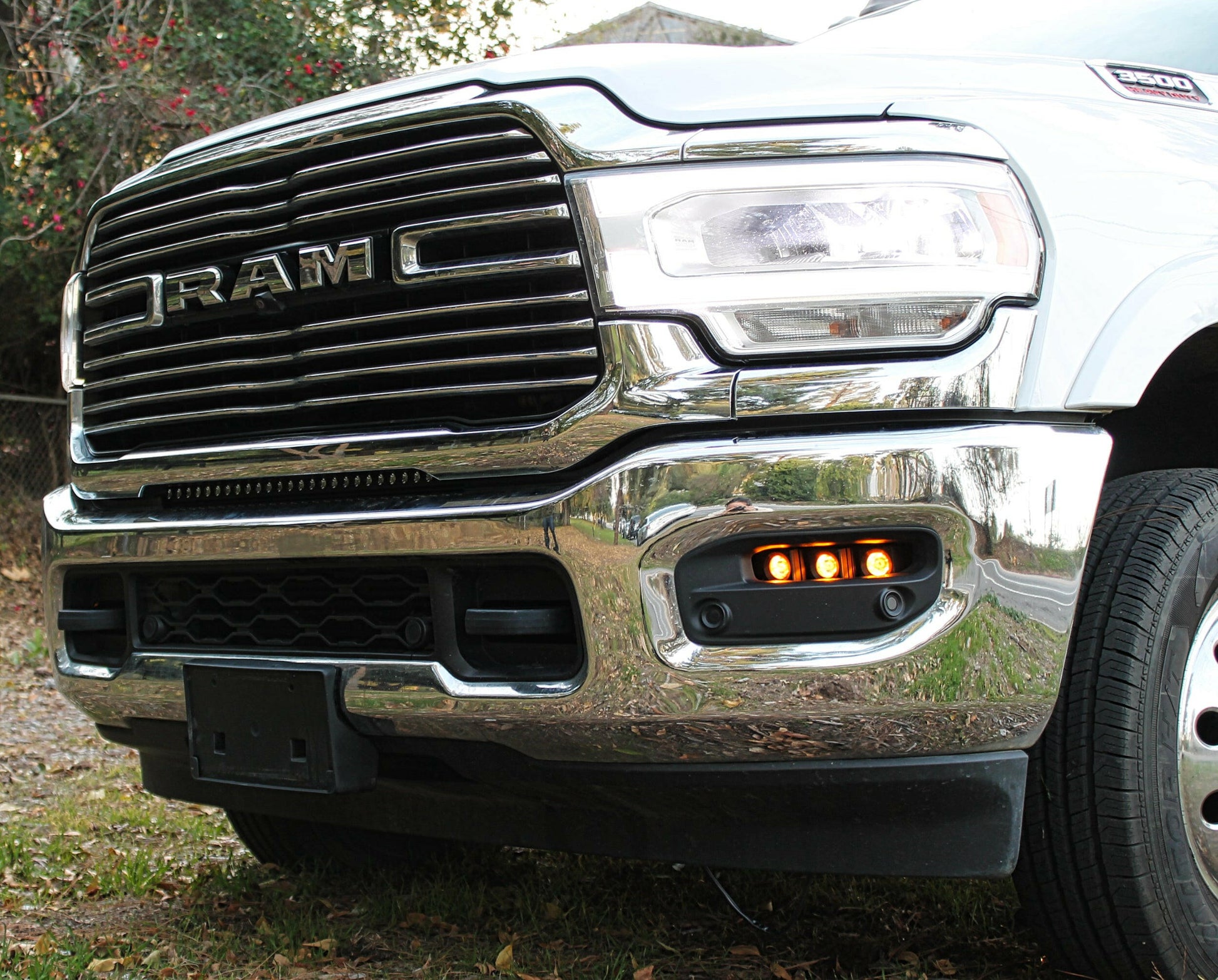 Close-up of a Ram truck's front grille with visible branding.