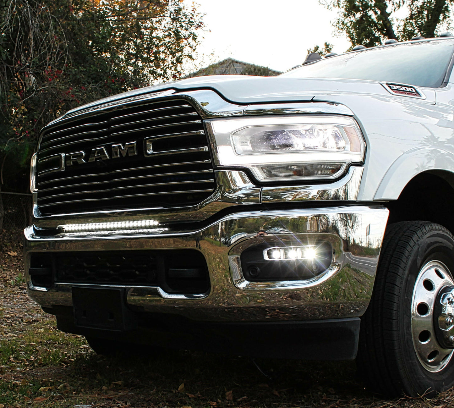 Close-up of a white Ram truck's LED Light Bar on front grille.