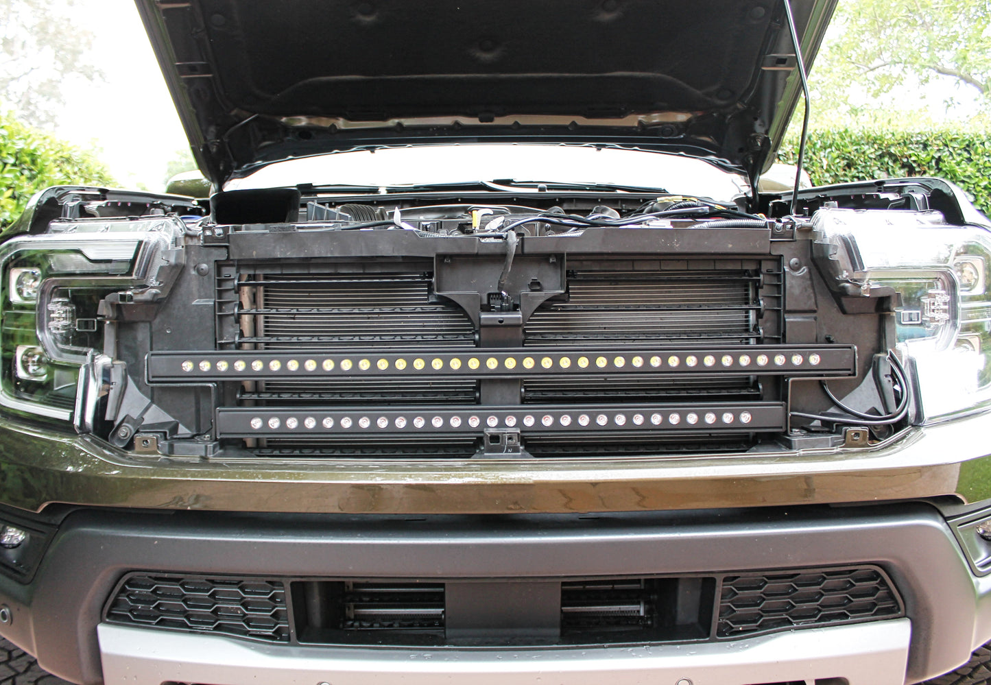 Close-up of a vehicle's front grille with LED lights installed