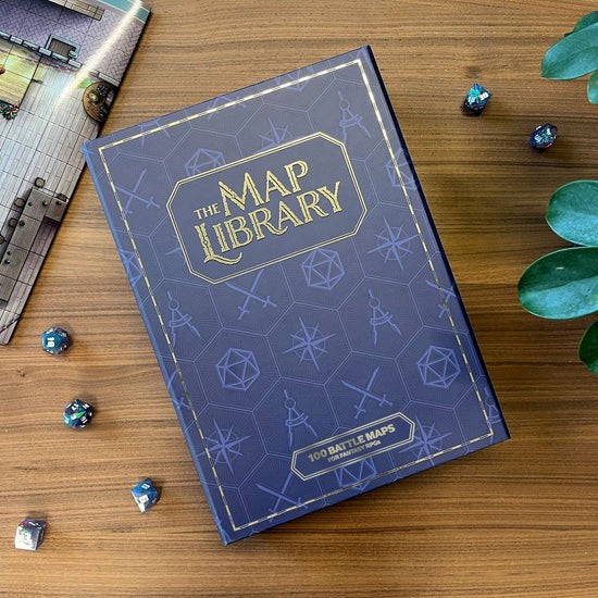 Blue book titled 'The Map Library' on a wooden surface with dice and a map.