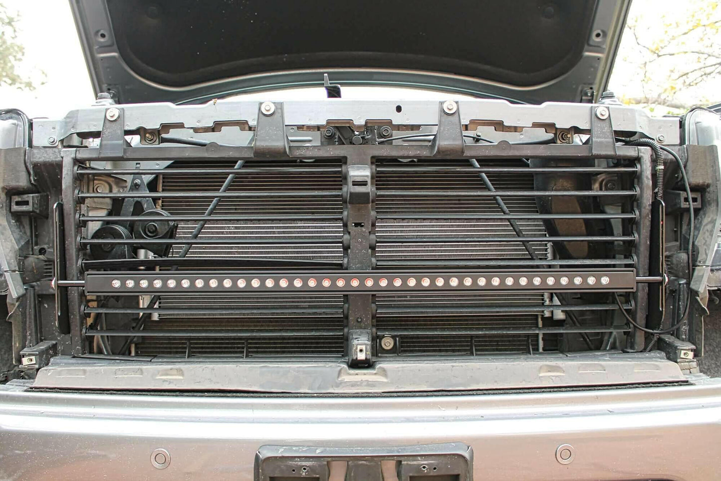 Black metal grille with LED lights on a vehicle