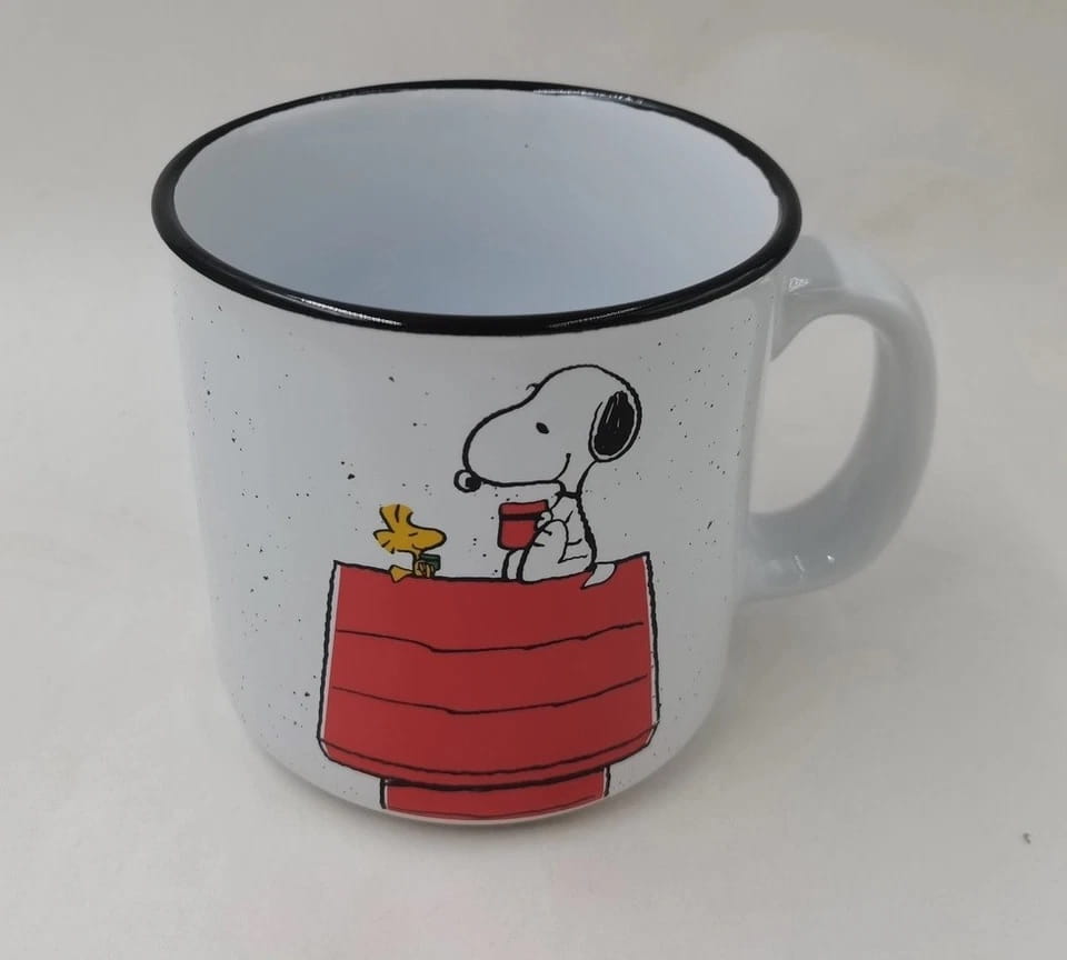 Snoop and Woodstock sitting on doghouse design on a ceramic mug 