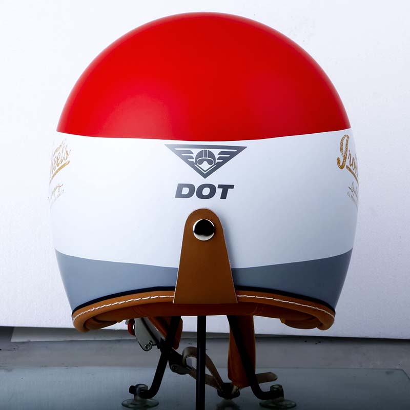 Red, white, and blue helmet with brown leather chin strap on a white background