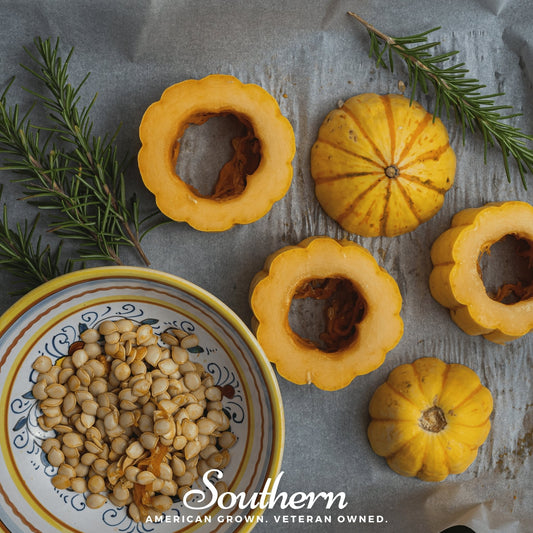 Small pumpkins with a bowl of seeds on a textured surface with 'Southern' branding.