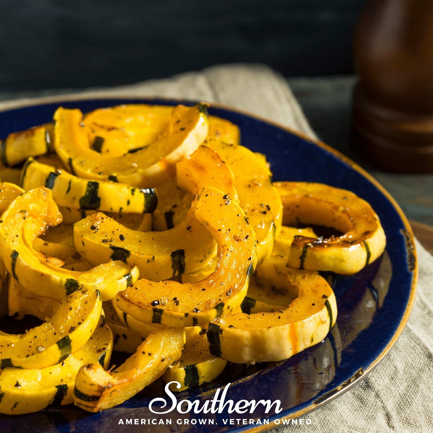 Sliced yellow squash on a blue plate with 'Southern' branding.