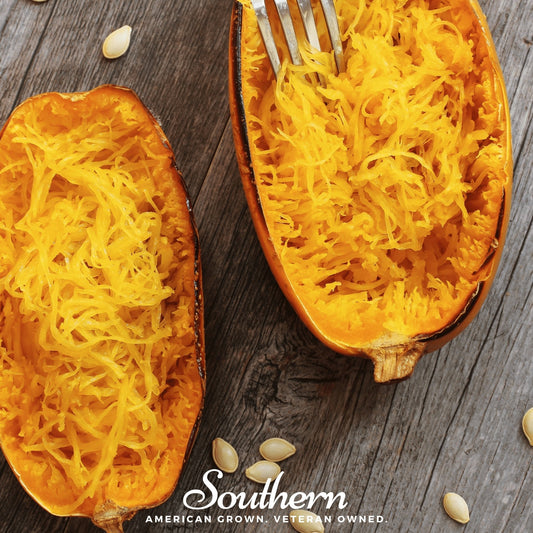 Two halves of a spaghetti squash with a fork on a wooden surface, branded 'Southern'.