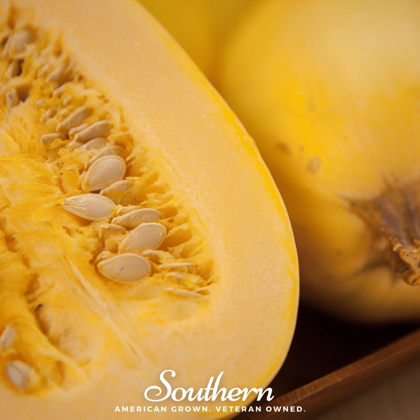 Close-up of a yellow squash with seeds, branded 'Southern'.