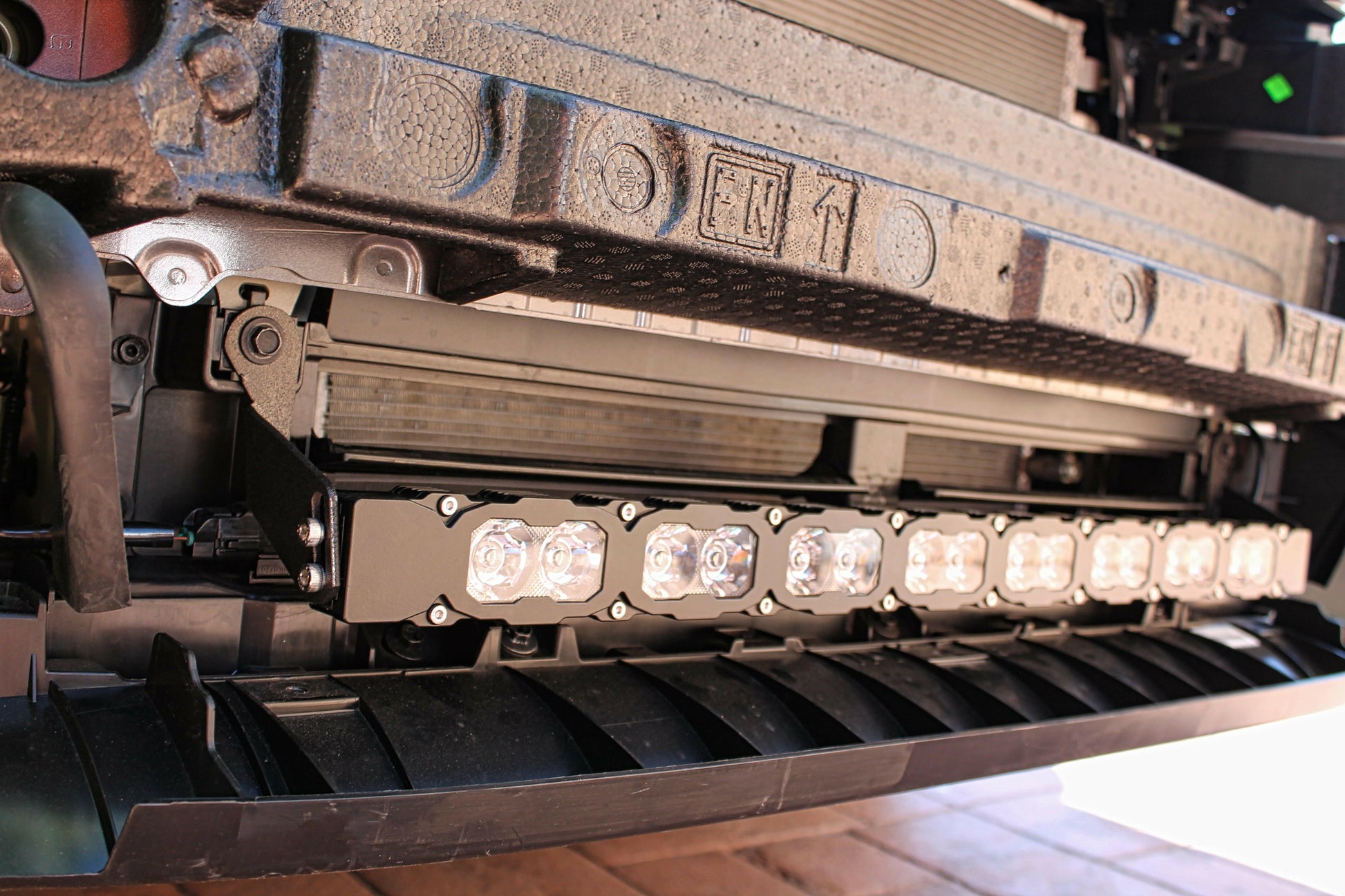 Close-up of a vehicle's undercarriage with LED lights