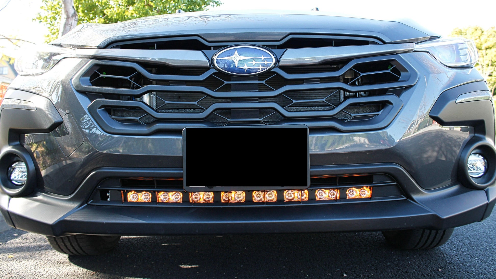 Close-up of a car's front grille with visible brand logo