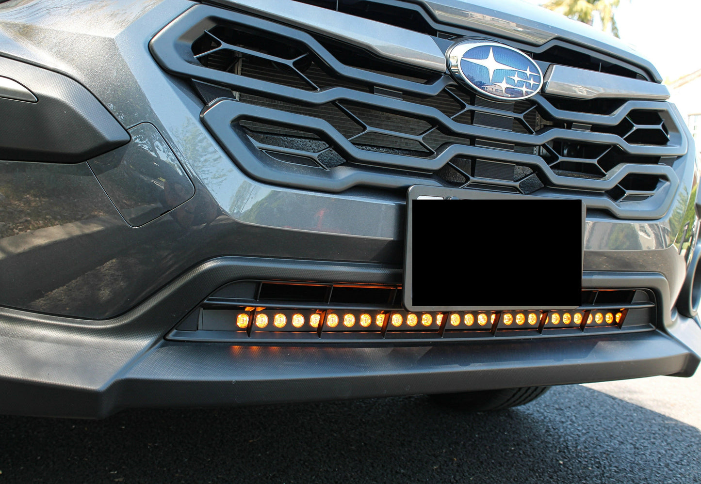 Close-up of a car's front grille with LED Light Bars