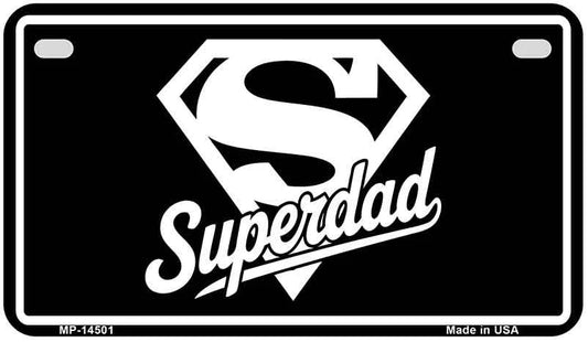 Black Motorcycle license plate with white Superman logo and 'Superdad' text, 'Made in USA' text at the bottom.