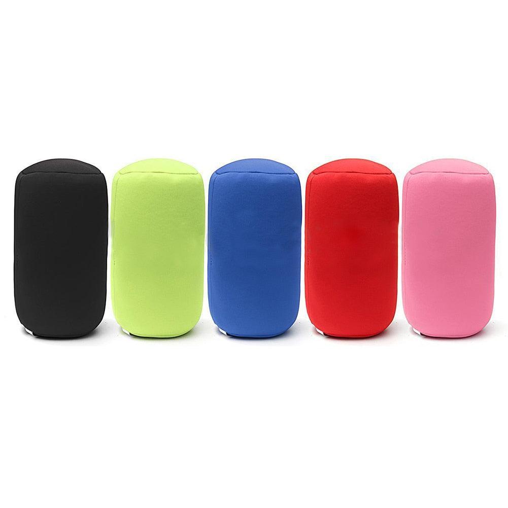 Five colorful cylindrical foam pillows on a white background