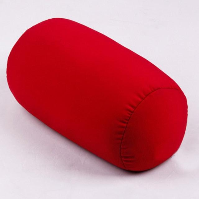 Red cylindrical pillow on a white background
