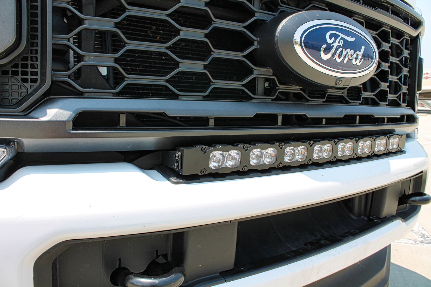 Ford vehicle grille with LED light bar and logo