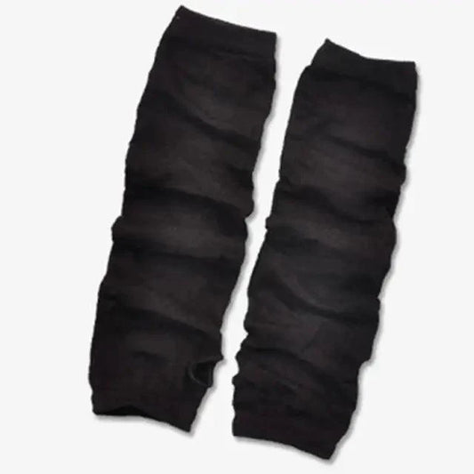 Pair of black leg warmers on a white background
