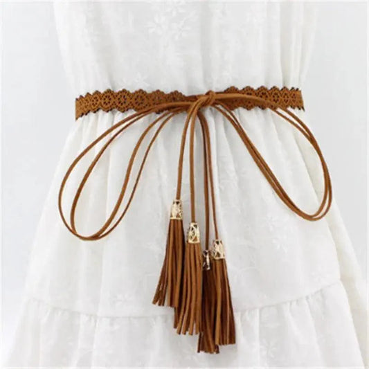 Brown belt with tassels on a white background