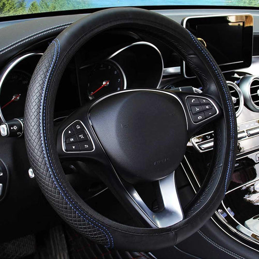Steering wheel of a car with dashboard in the background
