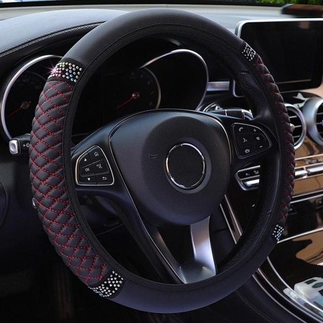 Steering wheel with decorative stitching in a car interior
