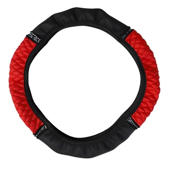 Red and black steering wheel cover on a white background
