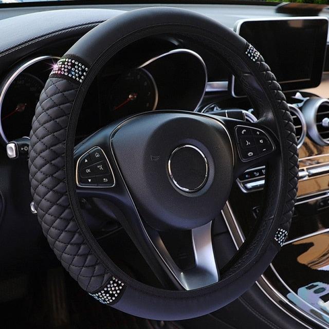 Steering wheel with decorative cover in a car interior