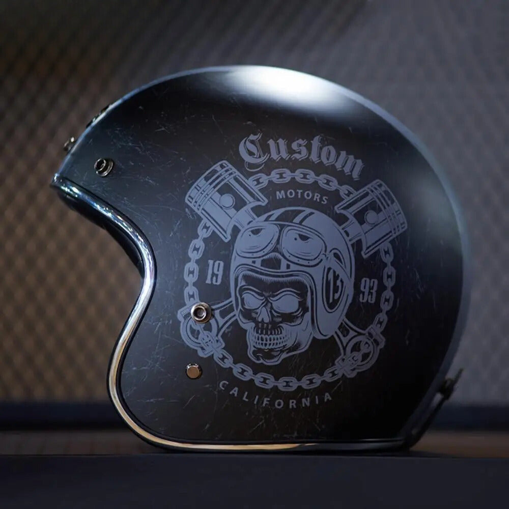 Black helmet with white graphic design on a dark background