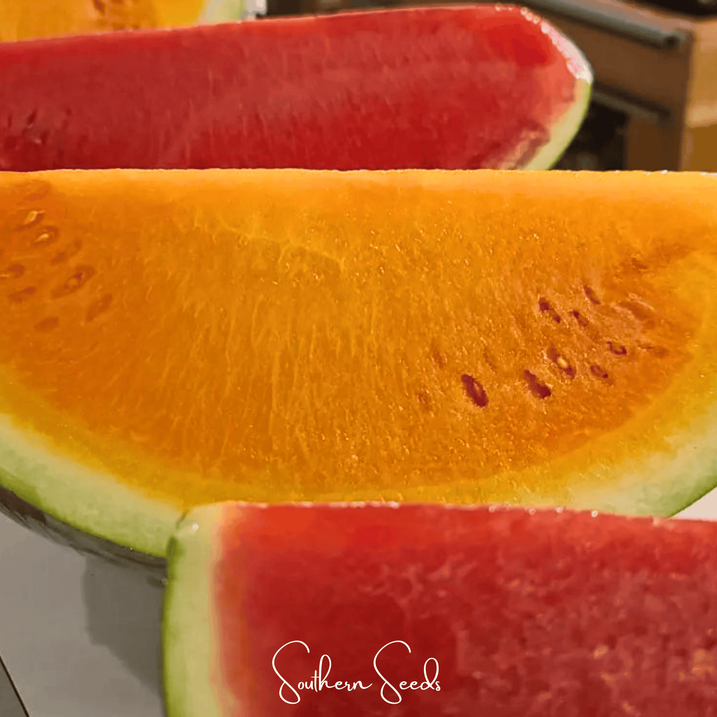 Close-up of sliced watermelon with 'Southern Seeds' branding.