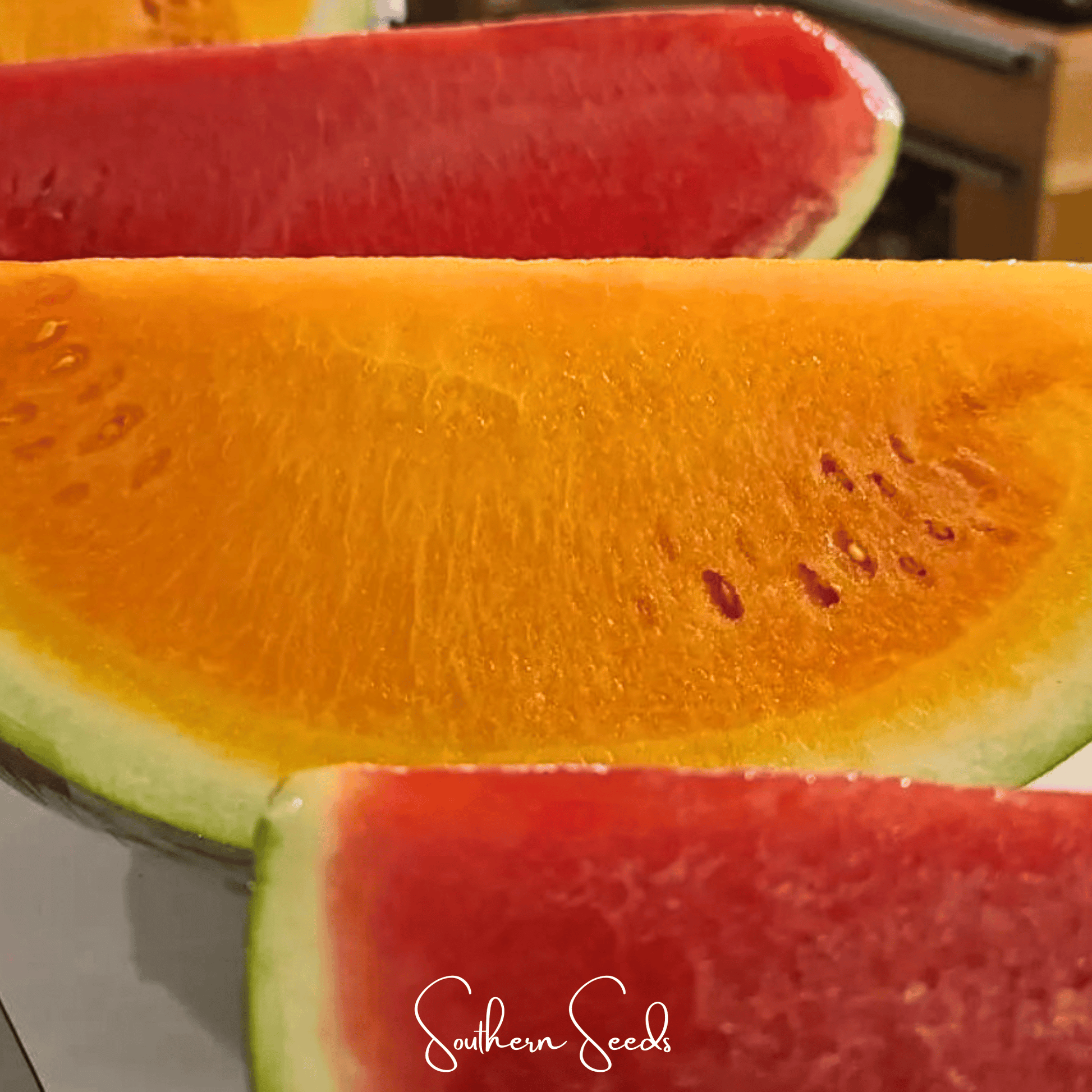 Close-up of sliced watermelon with 'Southern Seeds' branding.