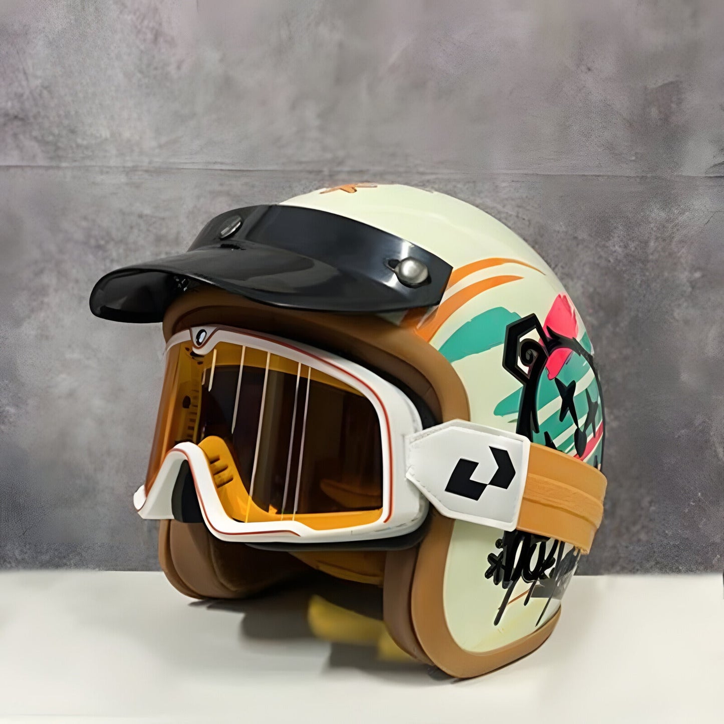 Colorful motorcycle helmet with abstract design on a gray background