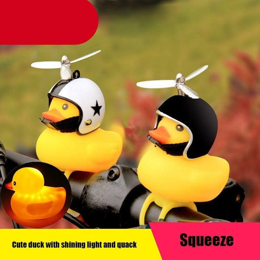 Two rubber ducks wearing helmets on a motorcycle with text about features.